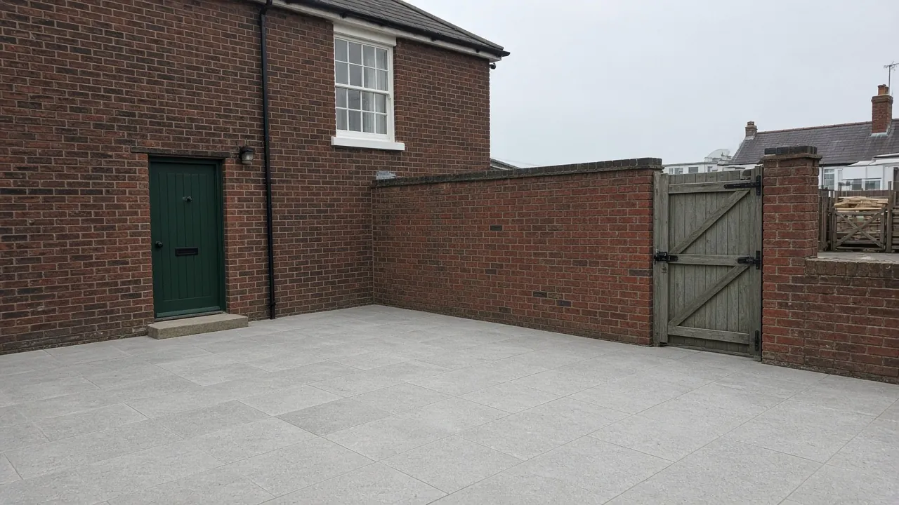 Example image: grey porcelain patio in a walled yard behind a Victorian terraced house near the sea in Coatham