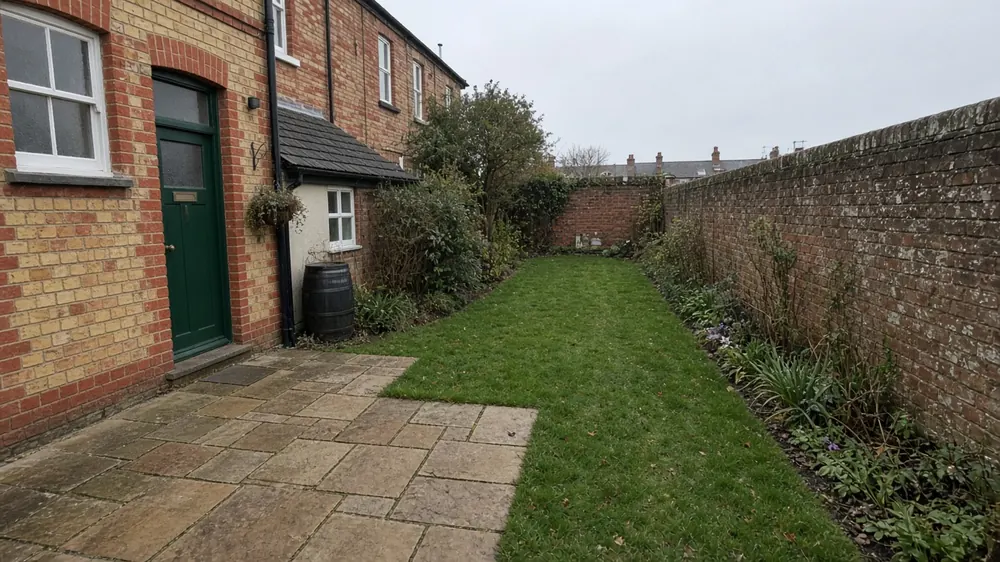 Example image: natural stone patio in the long back garden of a Victorian brick terrace on the coast